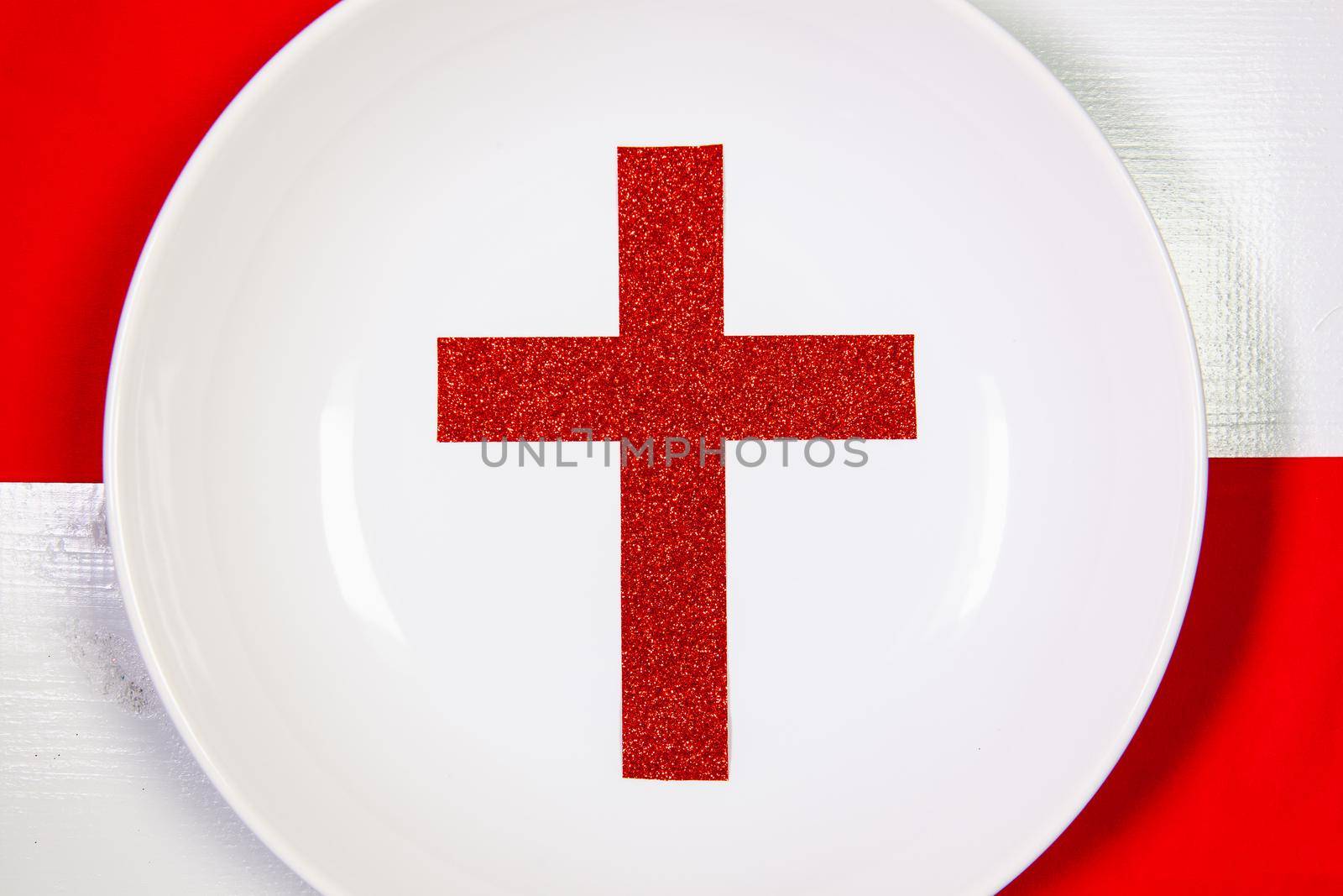 White plate and red Christmas decoration on the white wooden table. by CaptureLight