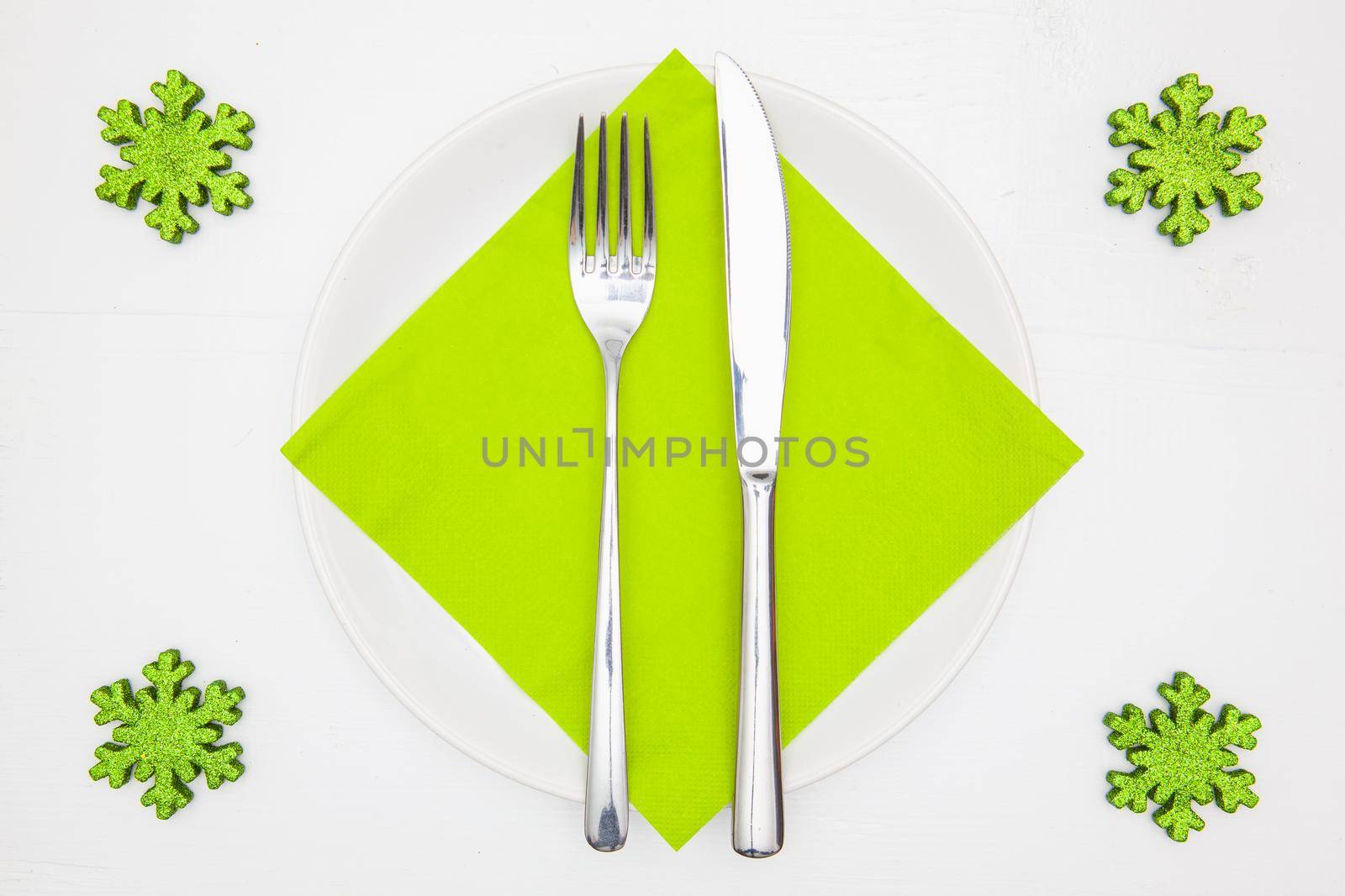 White square plate and green Christmas decoration  by CaptureLight