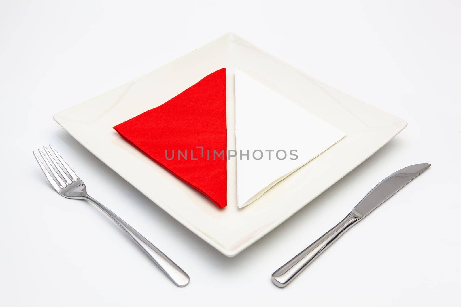 White square plate on the white wooden table. by CaptureLight