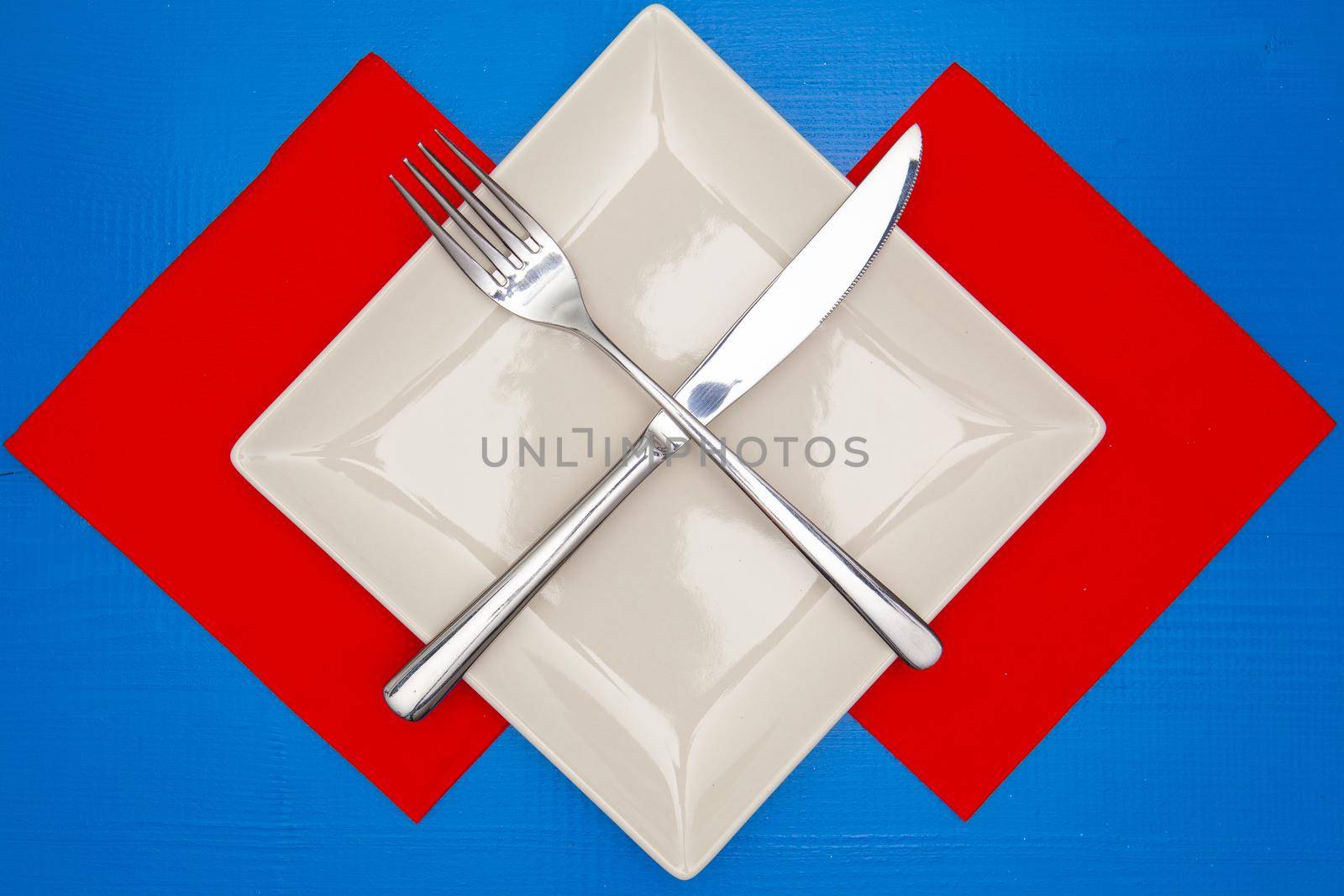 White square plate and red Christmas decoration by CaptureLight