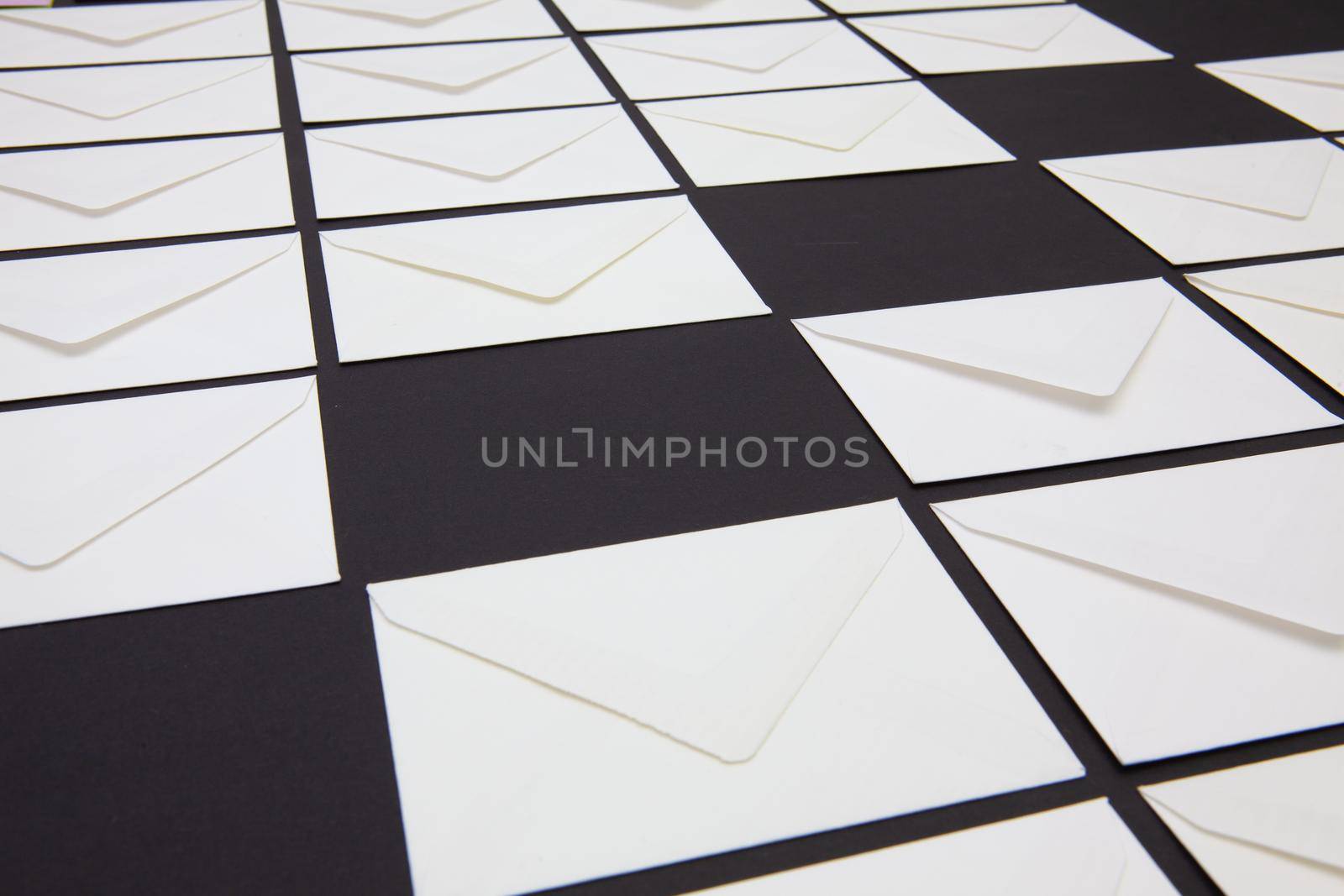 Composition with white envelopes on the table.  by CaptureLight