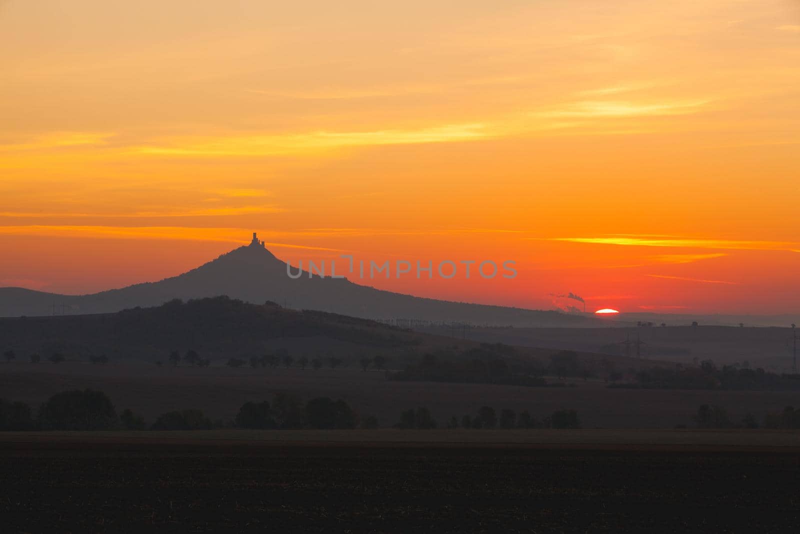 The silhouette of Hazmburk Castle at sunrise.Czech Republic. by CaptureLight