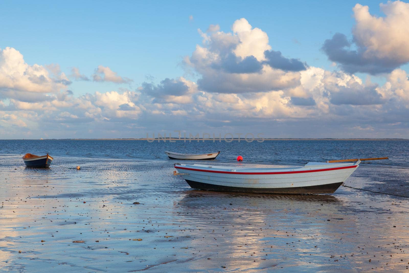 Fishing boats on the empty beach, Hjerting, Jutland, Denmark. by CaptureLight