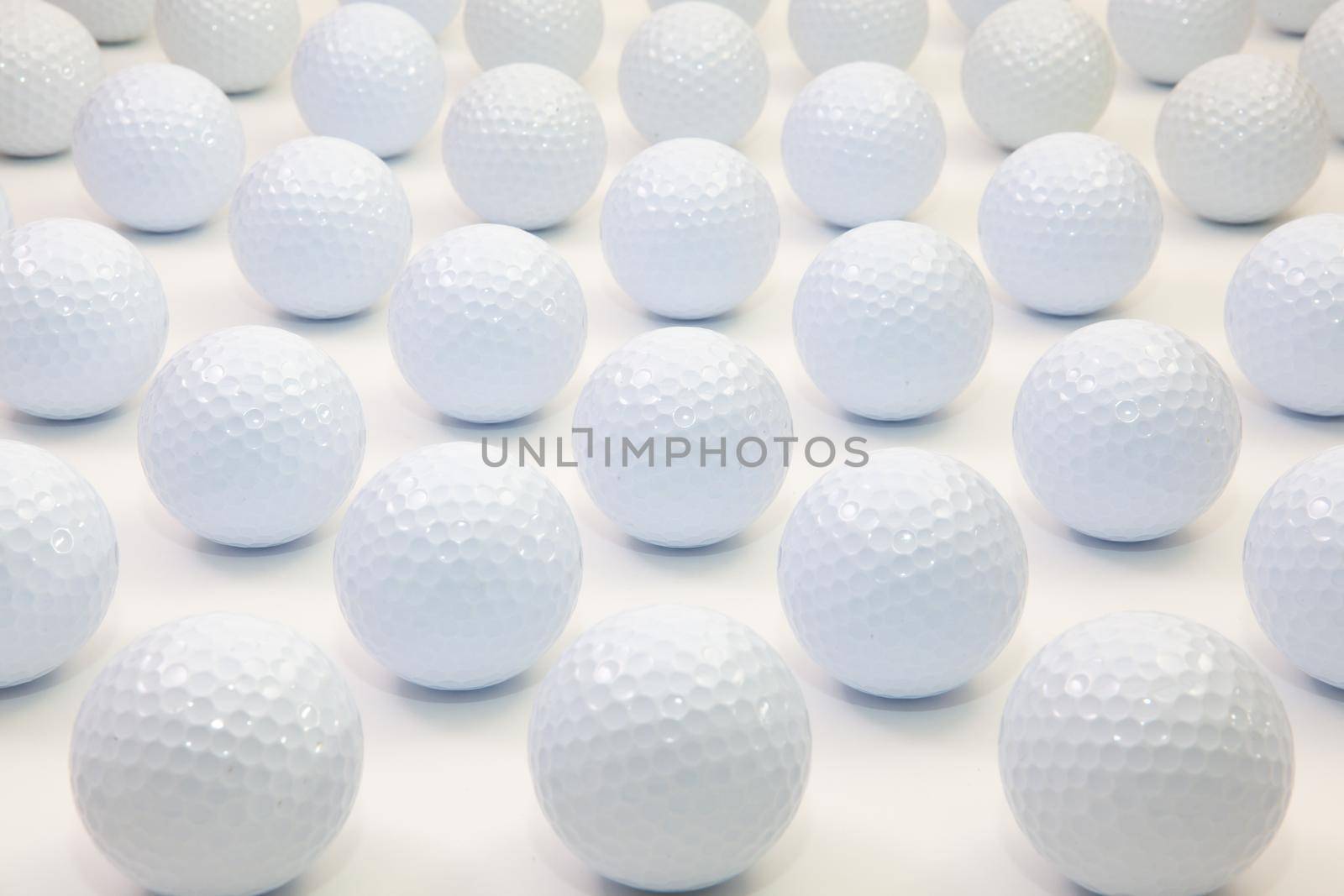 Pattern with white golf balls on the table.