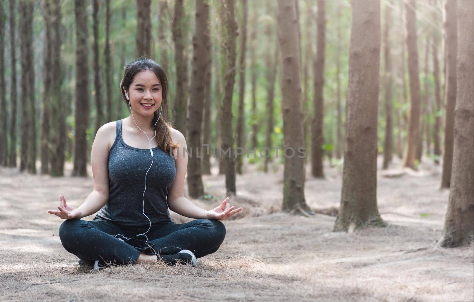 Young woman lifestyle relax sitting meditation yoga in morning at forest nature