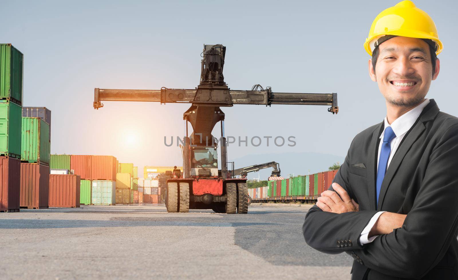 Businessman stand on front forklift loading Containers box to Logistic cargo Import Export Background