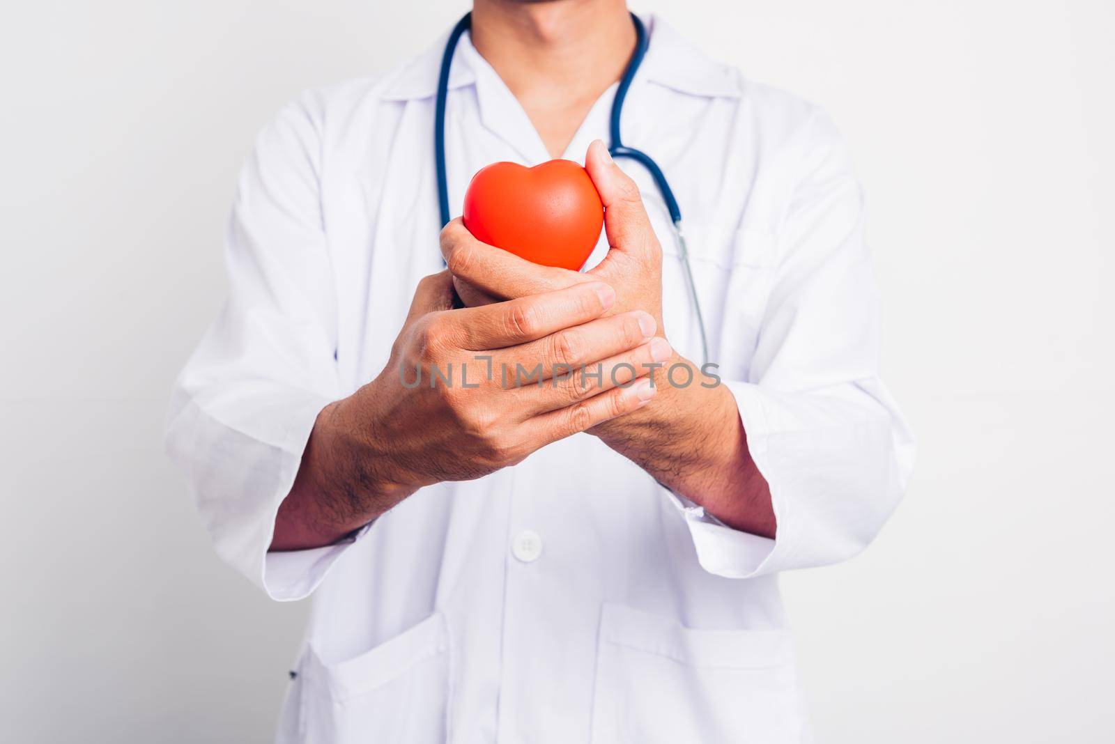 Close up Man doctor with stethoscope he is holding red heart on hand isolate on white background