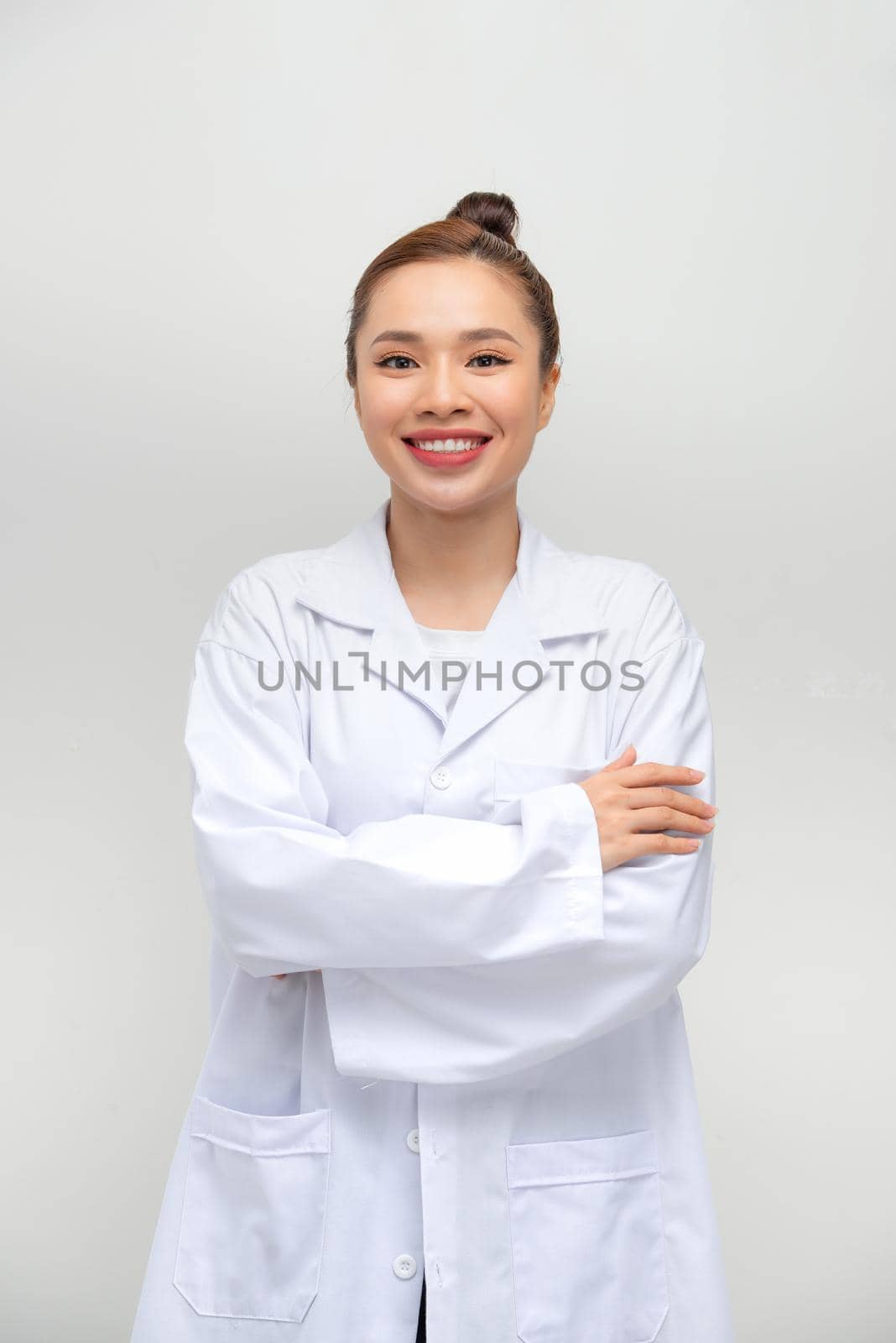 portrait of asian woman wearing white coat by makidotvn
