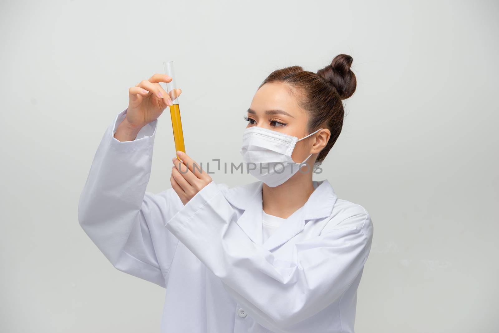 Woman doctor doing chemical tests in laboratory by makidotvn