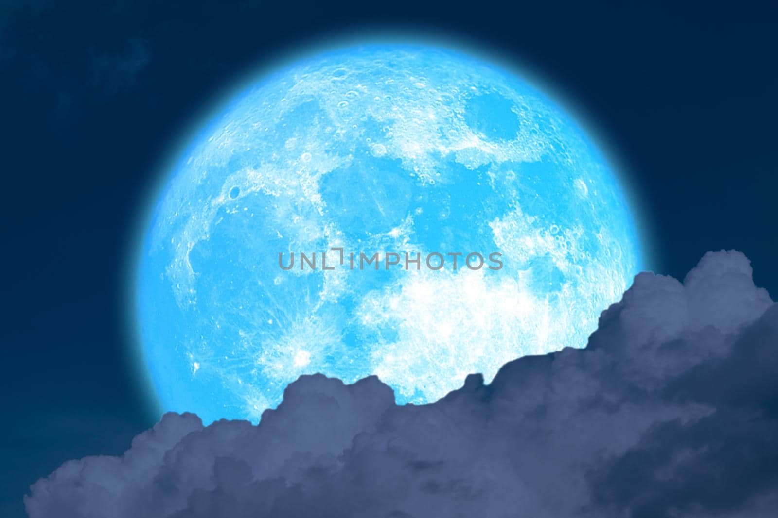 super flower blue moon rise back blur dark cloud on the night sky