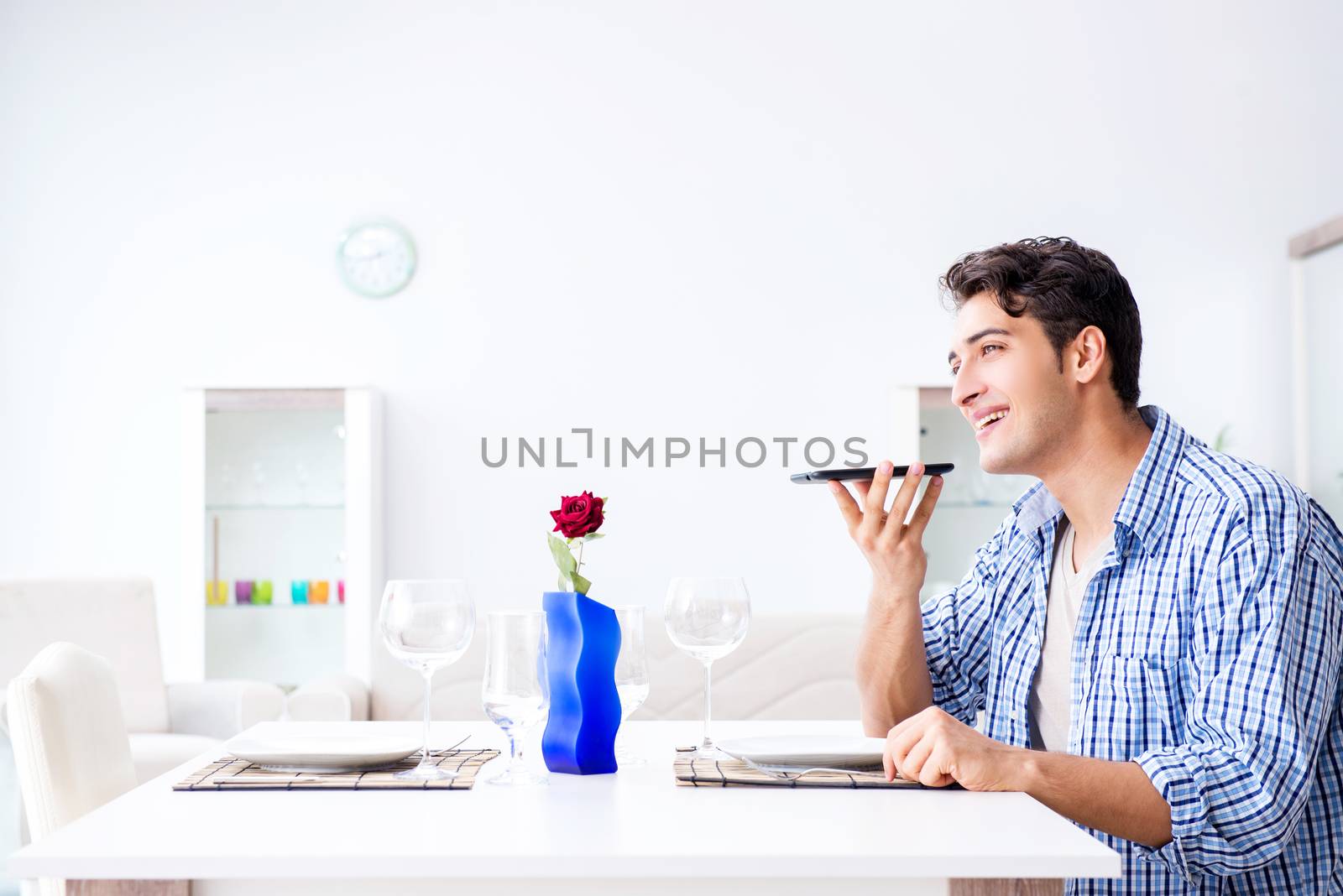 Man alone preparing for romantic date with his sweetheart