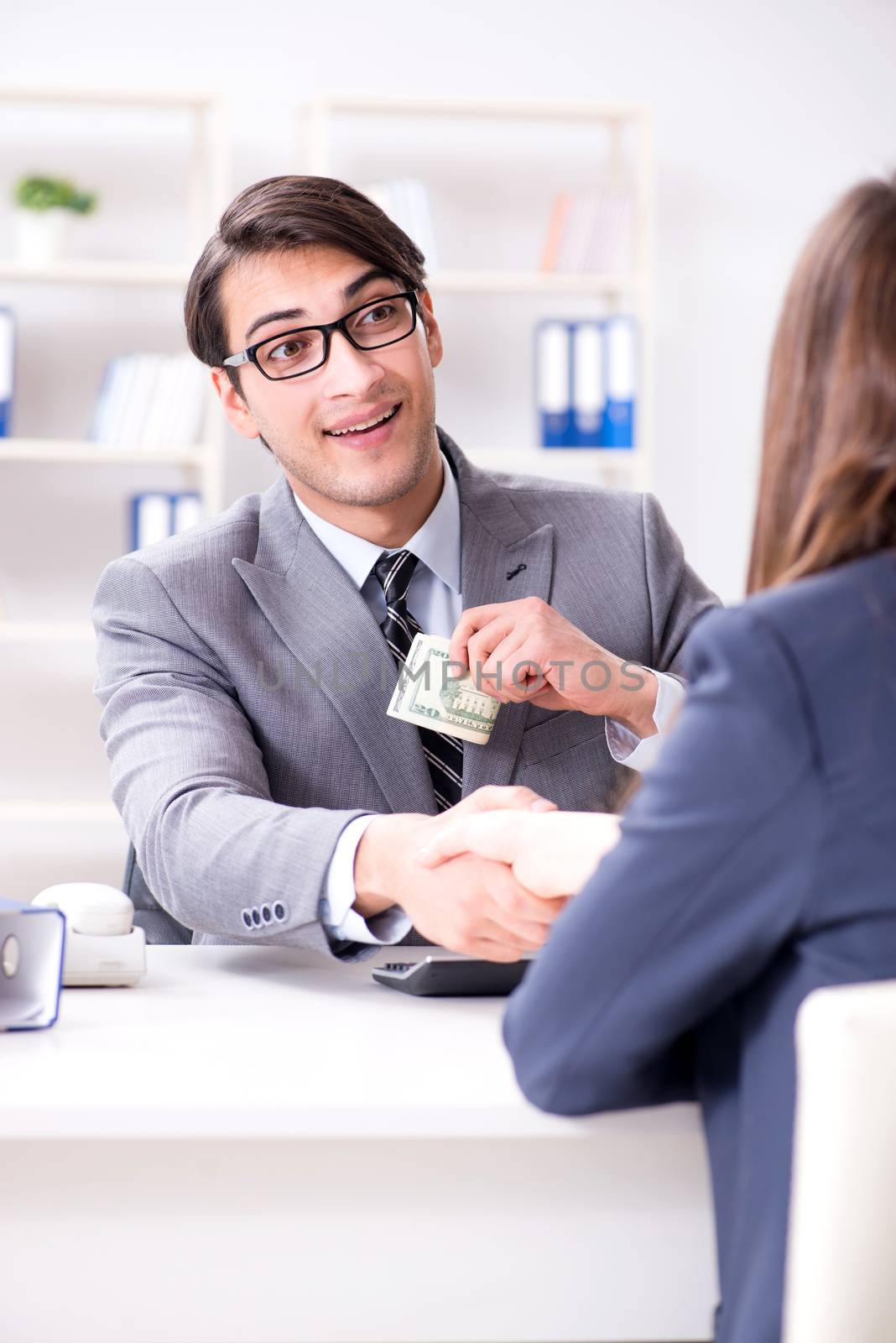 Businessman being offered bribe for breaking law