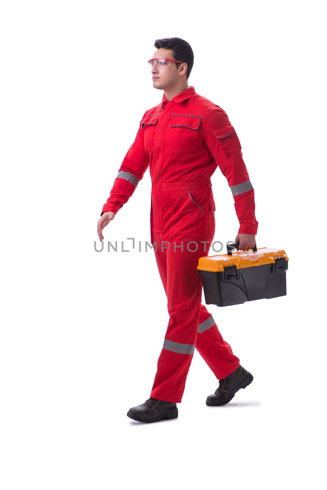Contractor worker in red coveralls with toolbox isolated on white