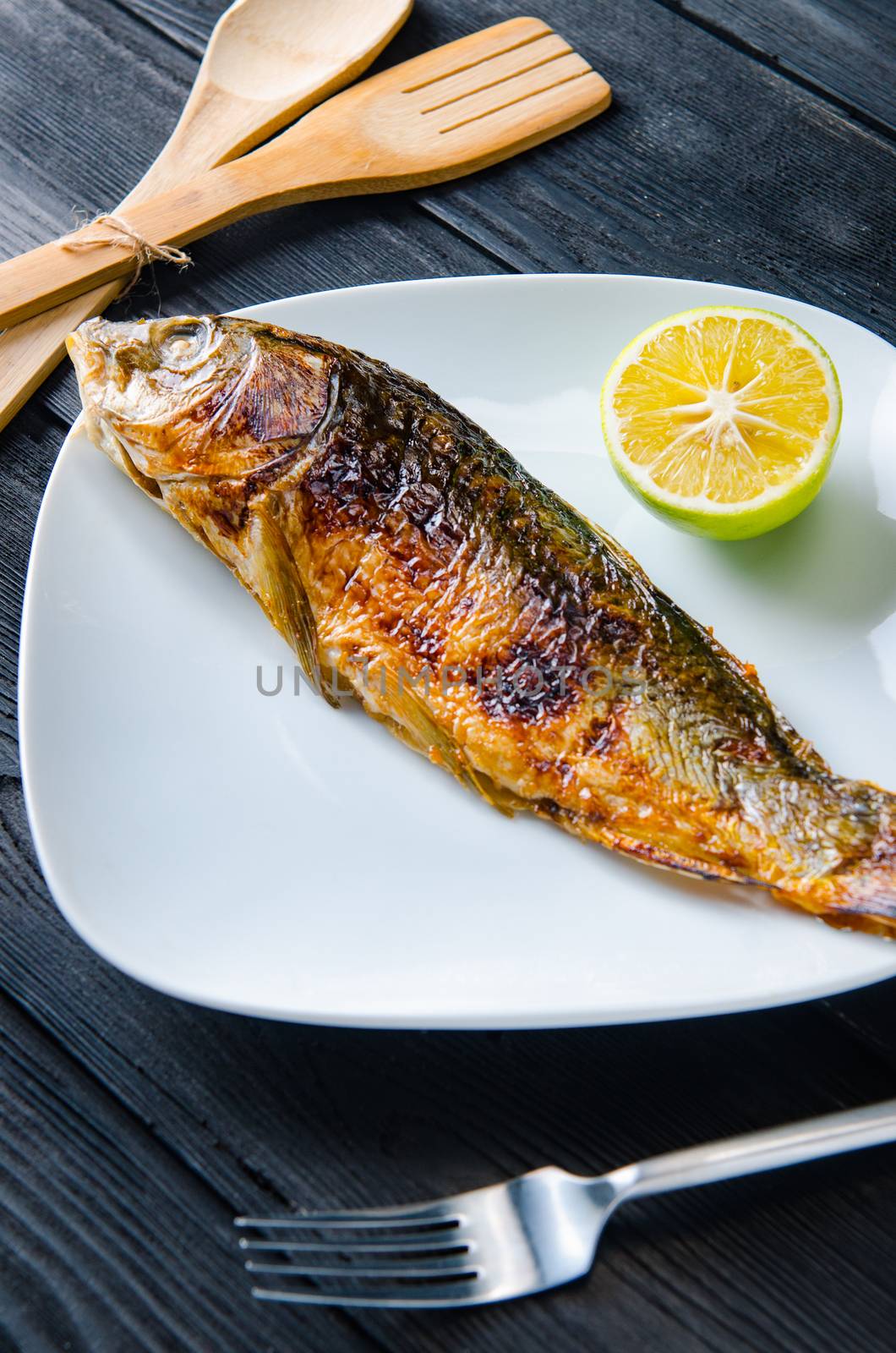Fried fish served on the plate