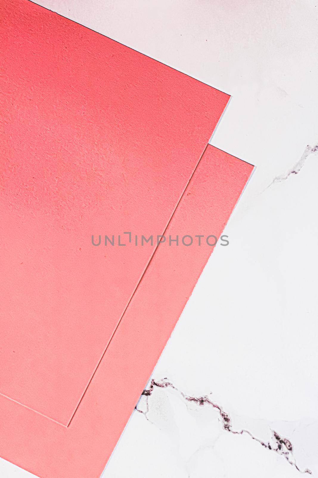 Pink A4 papers on white marble background as office stationery flatlay, luxury branding flat lay and brand identity design for mockups