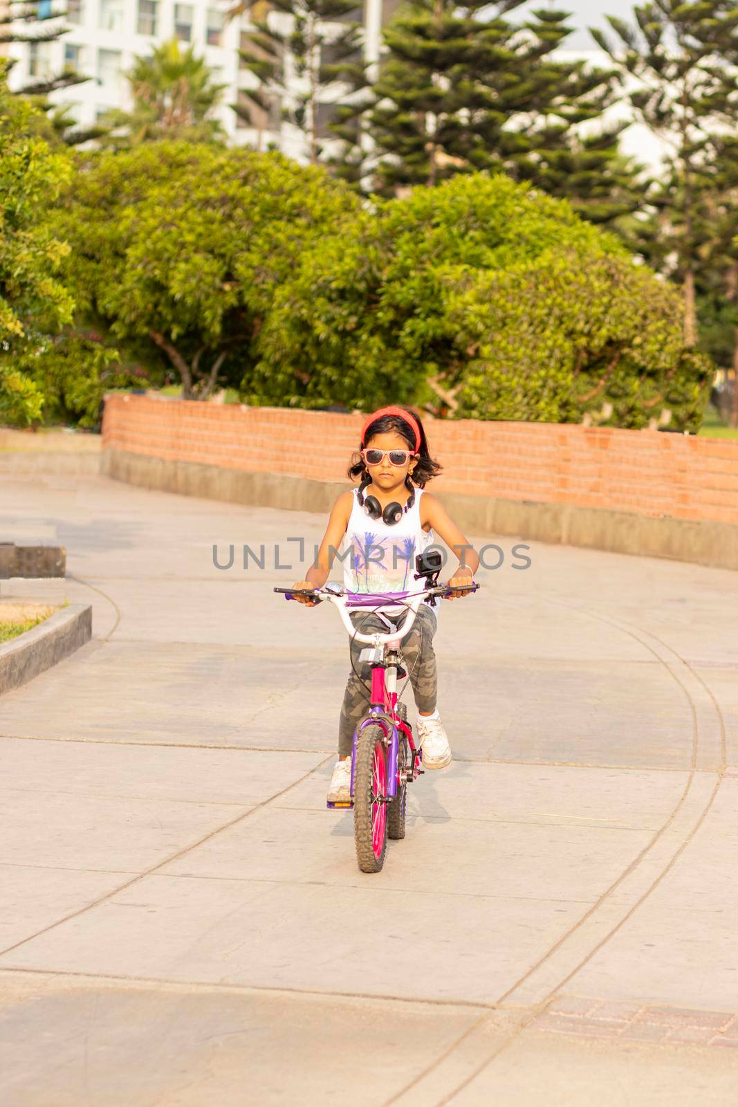 Little girl riding bicycle in the park