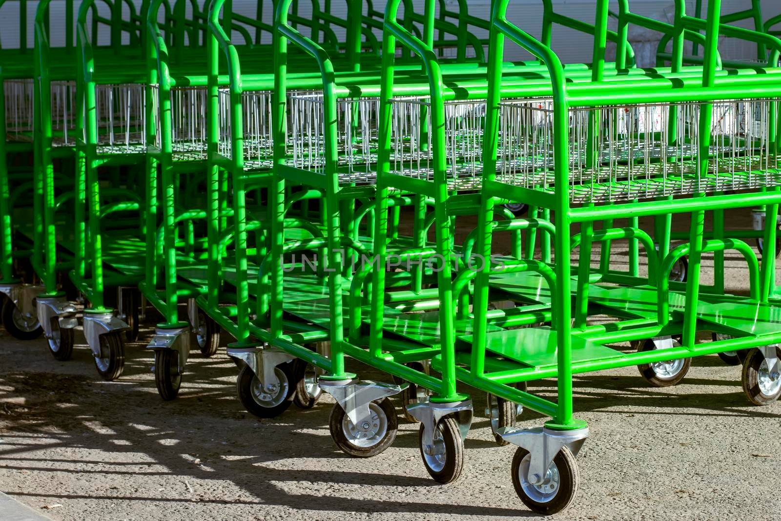 Carts near a construction supermarket. Sunny autumn day. Side view. by Essffes