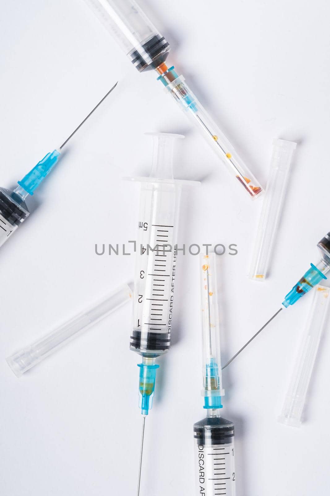 Dirty used plastic syringes, isolated by Frostroomhead