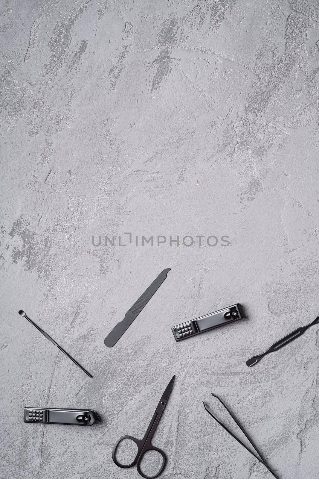 Set of manicure, pedicure tools and accessories, stone concrete background, top view copy space by Frostroomhead