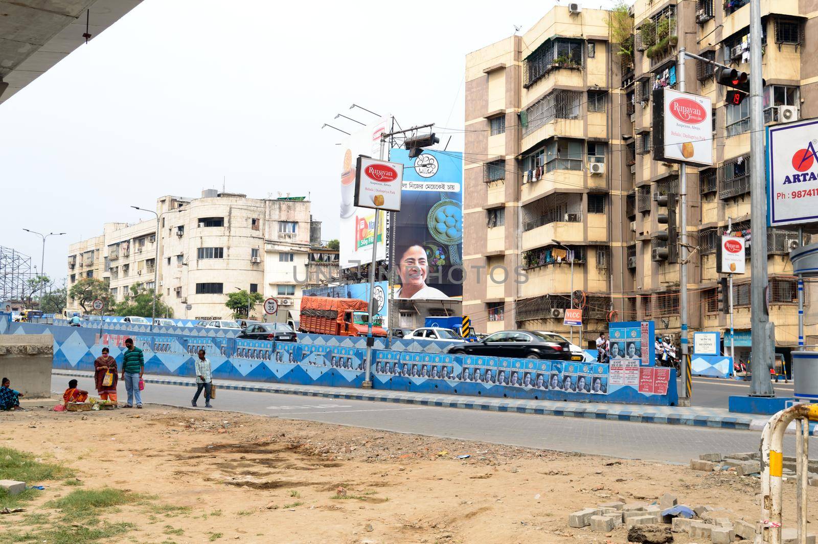 Political hoarding of Mamata Banerjee Trinamool Congress supreme showing Bangla Nijer Meye kei Chay (Bengal wants its own daughter ) in city street of Kolkata West Bengal India 17 April 2021 by sudiptabhowmick