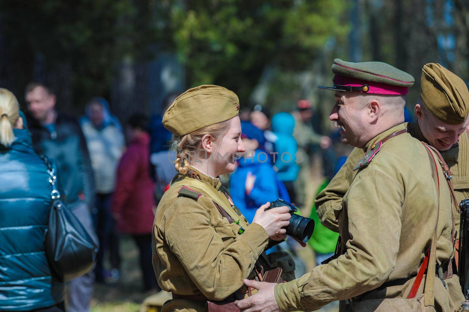 Reconstruction of the Second World War. A Russian soldier talks to a girl like a photographer. The Great Patriotic War. Liberation of Odessa. Zelenograd Russia April 18, 2021