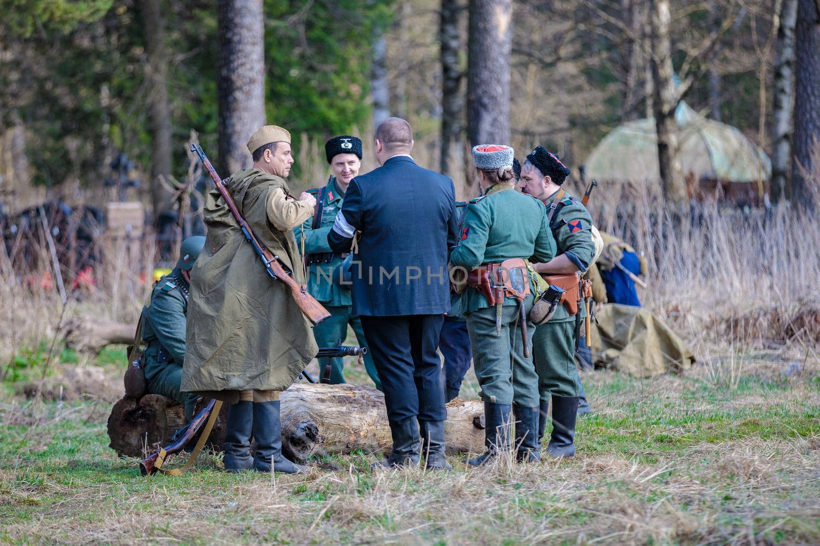 Reconstruction of the Second World War. The soldiers are standing in groups, talking. The Great Patriotic War. Liberation of Odessa. Zelenograd Russia April 18, 2021