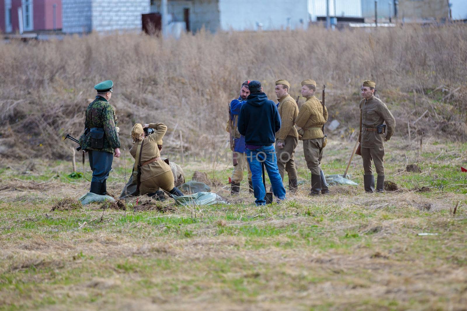 Reconstruction of the Second World War. The soldiers are standing in groups, talking. The Great Patriotic War. Liberation of Odessa. Zelenograd Russia April 18, 2021