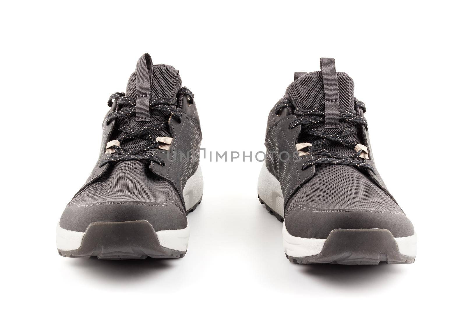 pair of black airmesh summer walking lightweight shoes isolated on white background, frontal view