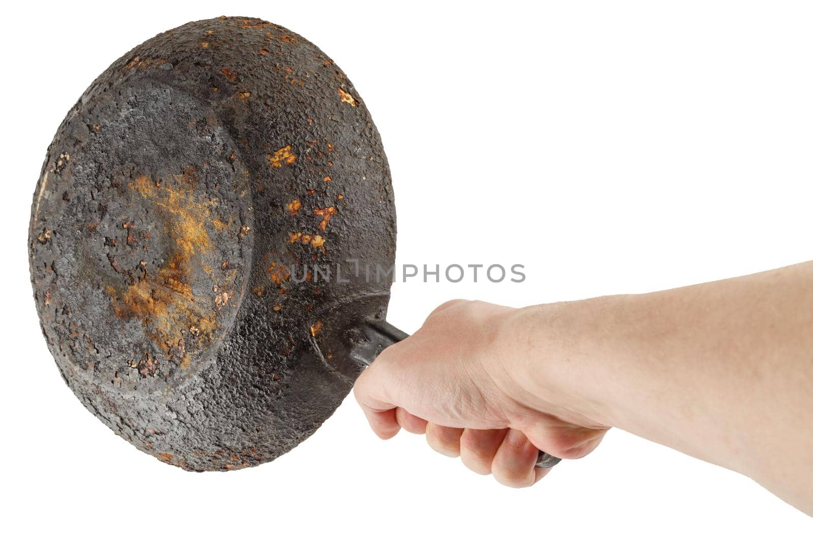 bare caucasian hand holding empty old cast iron frying pan - isolated on white background