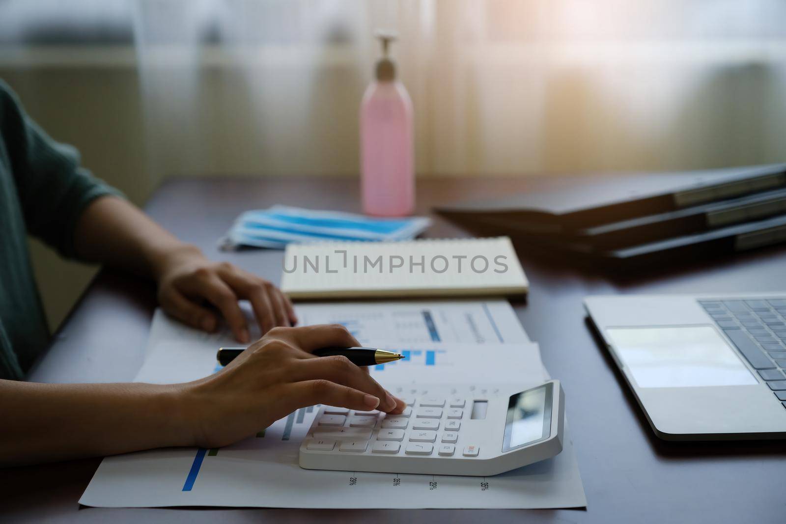 Business woman working by calculator and remotely from home. accountant, tax, financial, audit concept