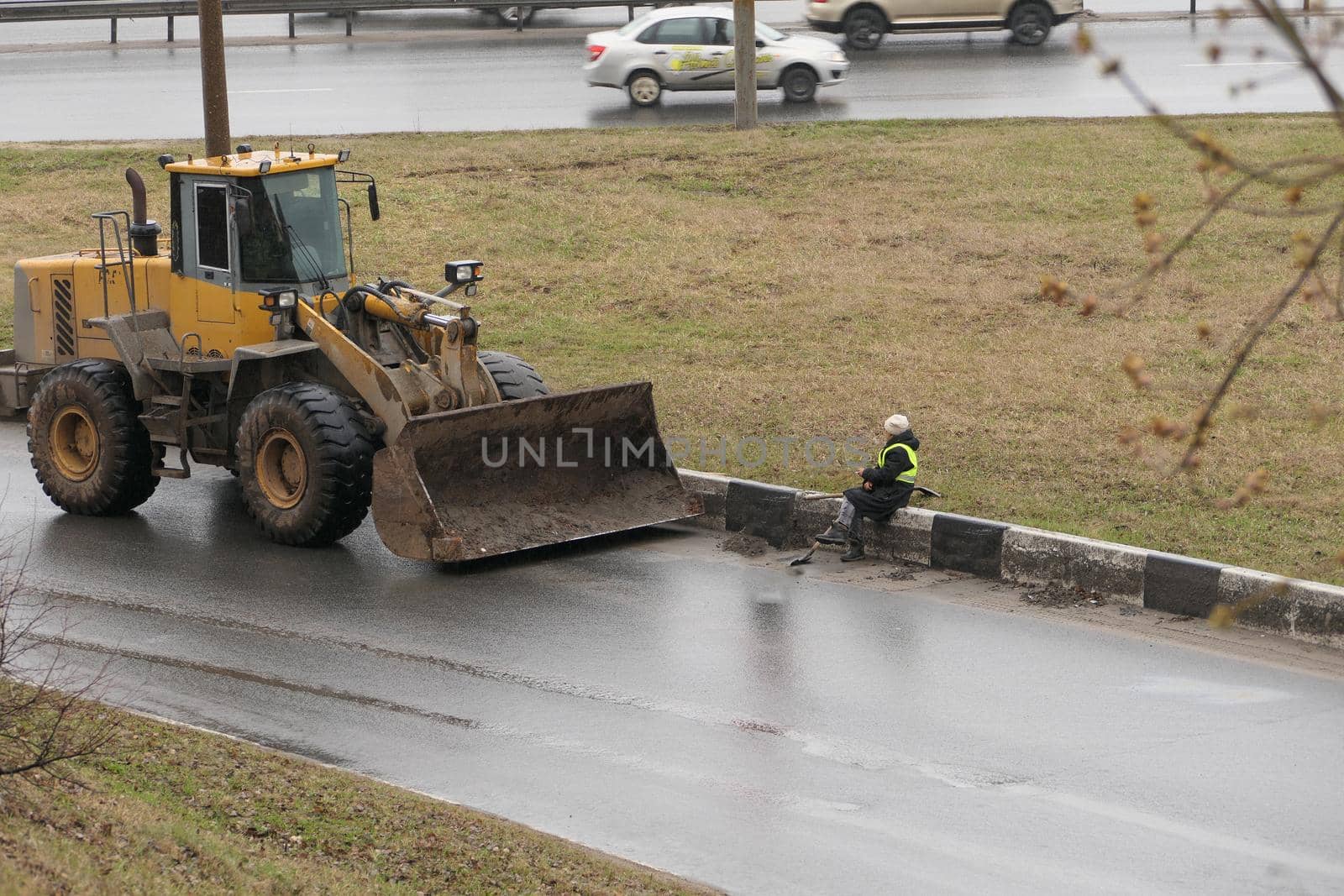 It's a clean city. People, workers clean the roads. Roadworks and road cleaning. High quality photo