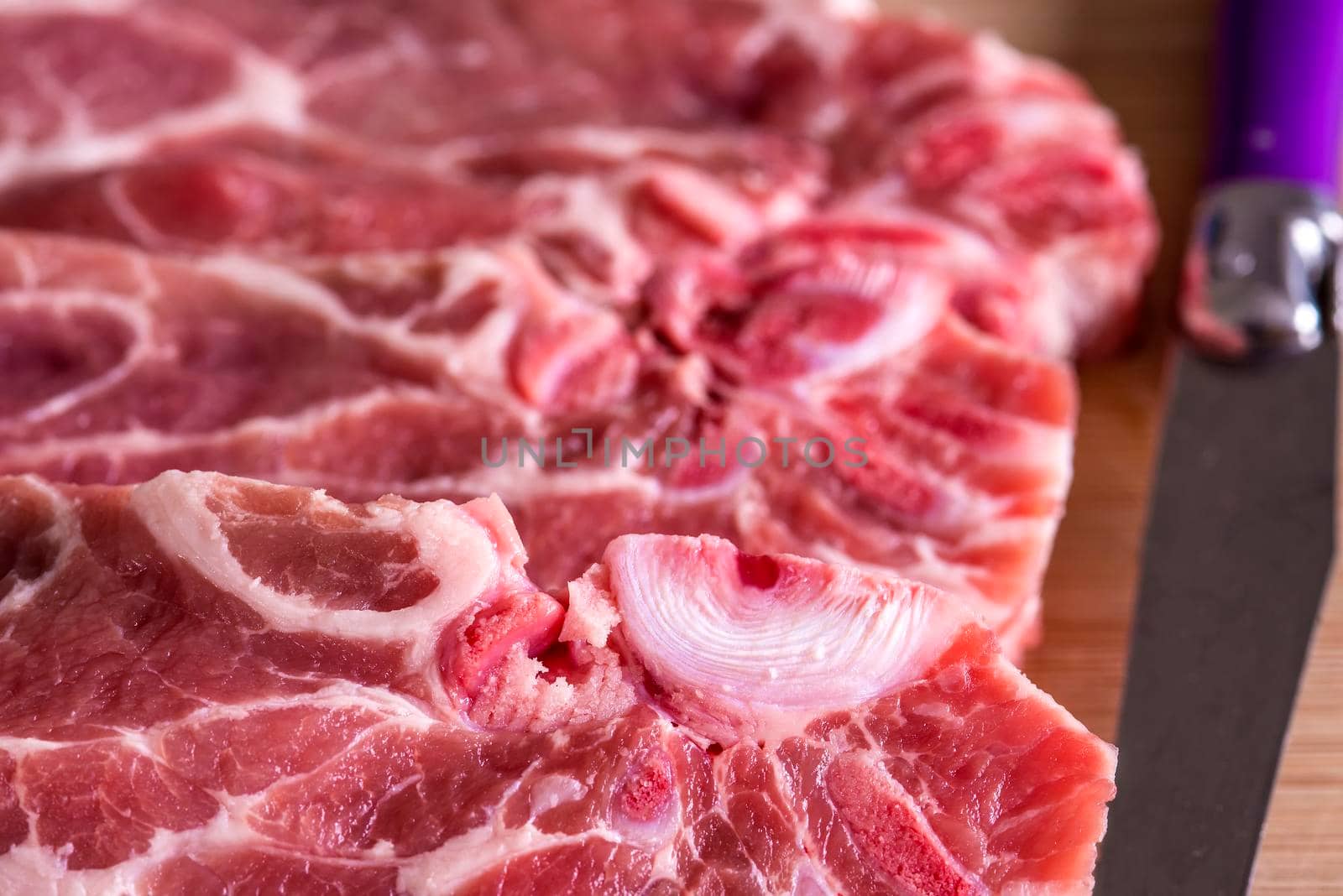 raw pork chop in a closeup by Jochen