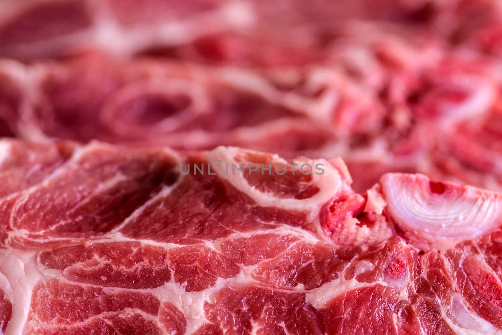 raw pork chop in a closeup by Jochen