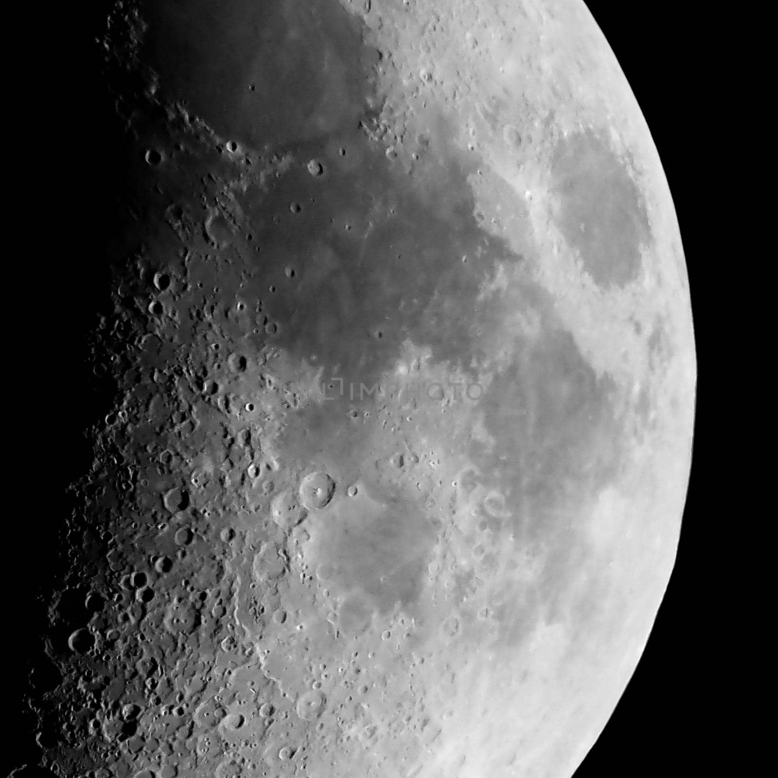 First quarter moon seen with an astronomical telescope, detail in black and white