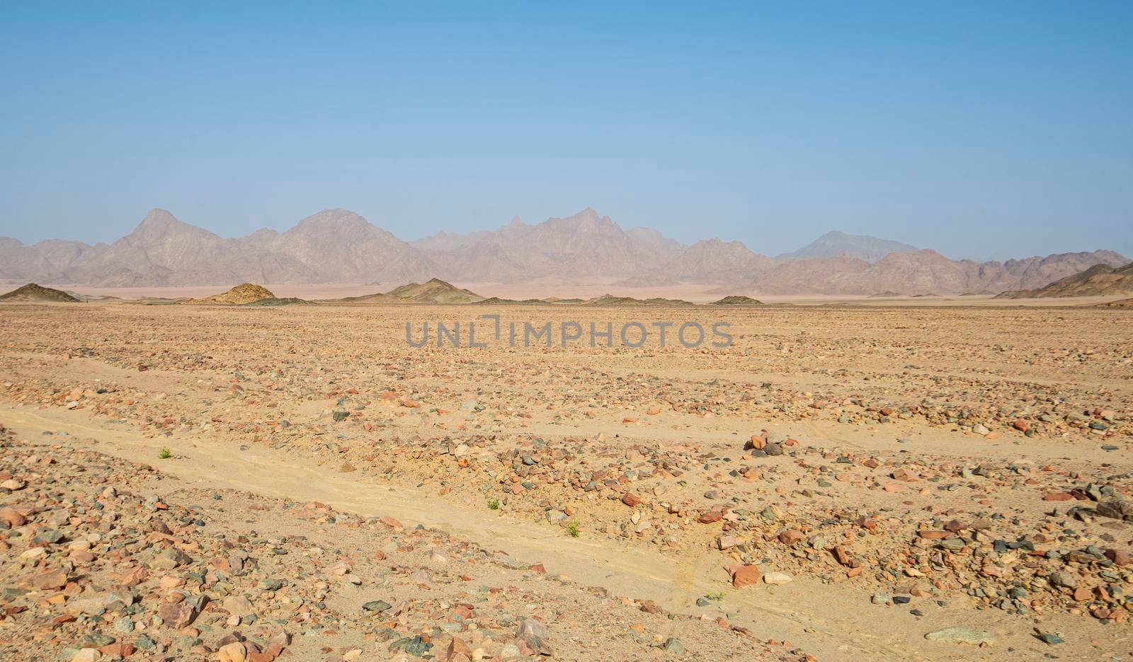 Landscape scenic view of desolate barren rocky eastern desert in Egypt with mountains