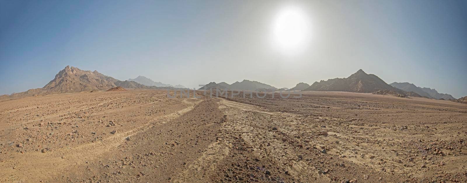 Barren rocky desert landscape in hot climate by paulvinten