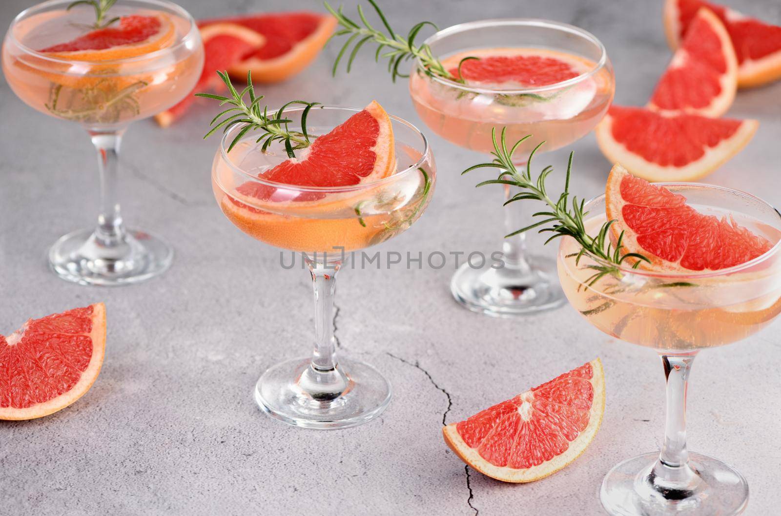 Сocktail Mimosa.  Grapefruit, rosemary and sparkling wine by Apolonia