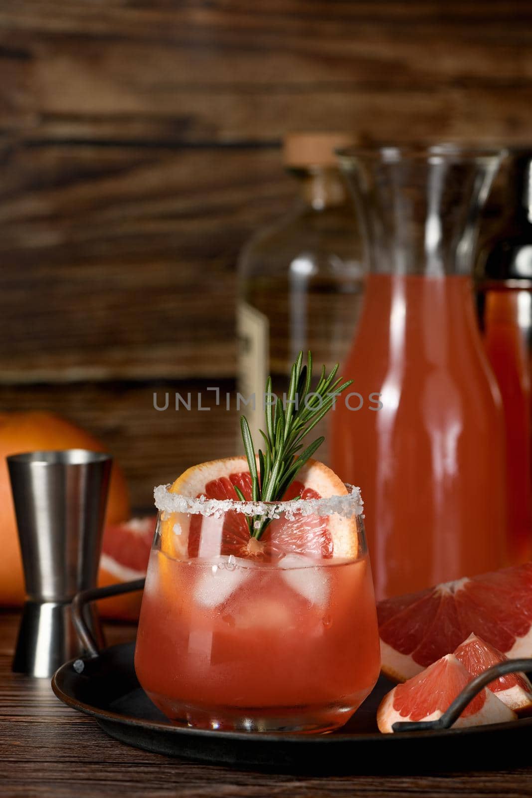 Cocktail tequila fresh grapefruit juice combined and rosemary. A festive drink is ideal for brunch, parties and holidays.