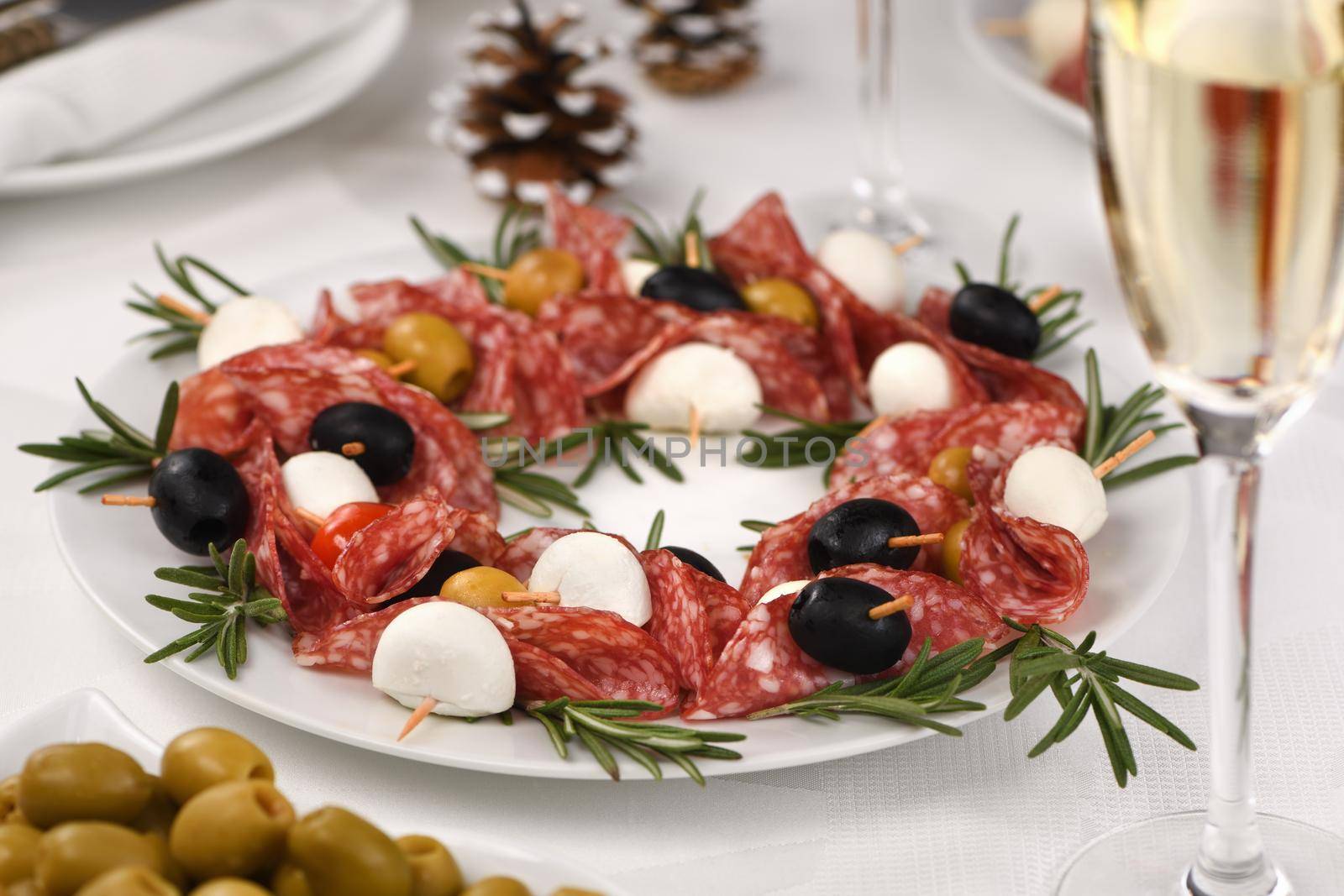  Christmas wreath - antipasto. Salami canapes with olives, baby mozzarella.