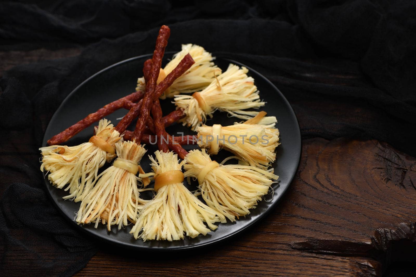 Witches Broom of smoked cheese suluguni and salami  by Apolonia