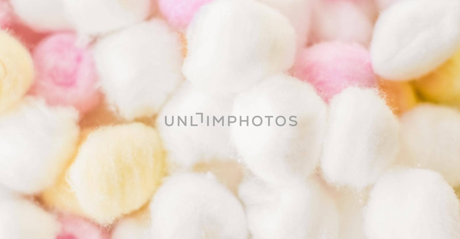 Cosmetology, branding and cleanliness concept - Organic cotton balls background for morning routine, spa cosmetics, hygiene and natural skincare beauty brand product as healthcare and medical design