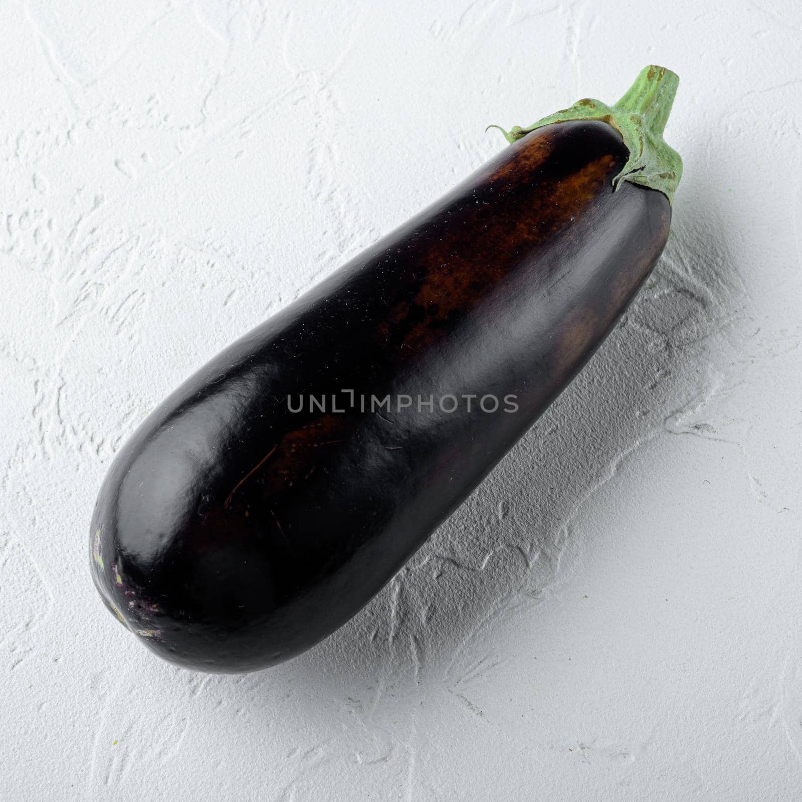 Eggplant, aubergine organic ripe whole vegetables, square format, on white stone background by Ilianesolenyi