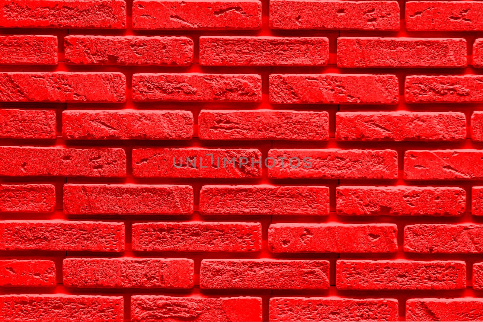 Red Background is made of artificial stone. Side view, indoors horizontal shot. by Essffes