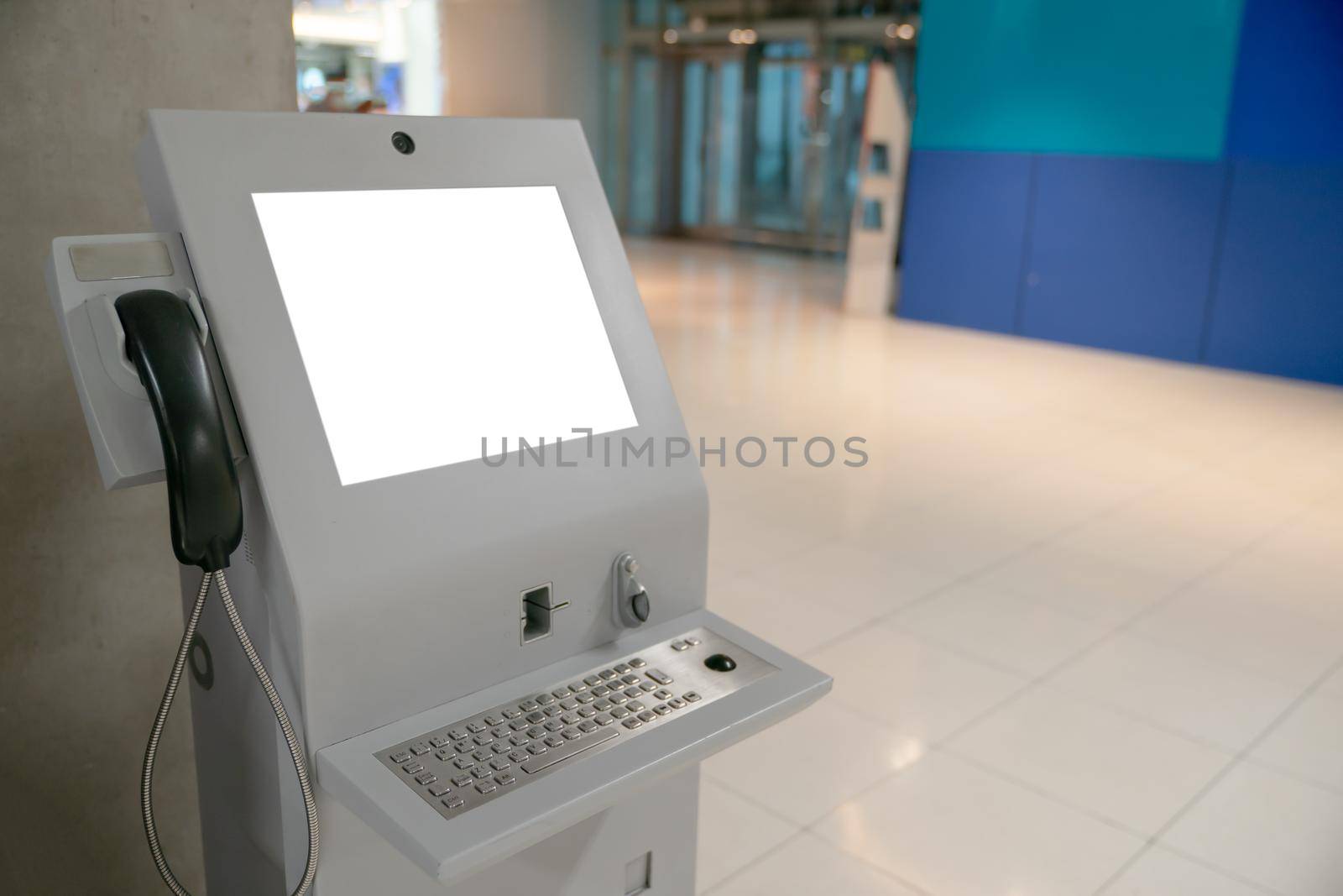 Automated information machine with mock up white screen in airport. by sirawit99