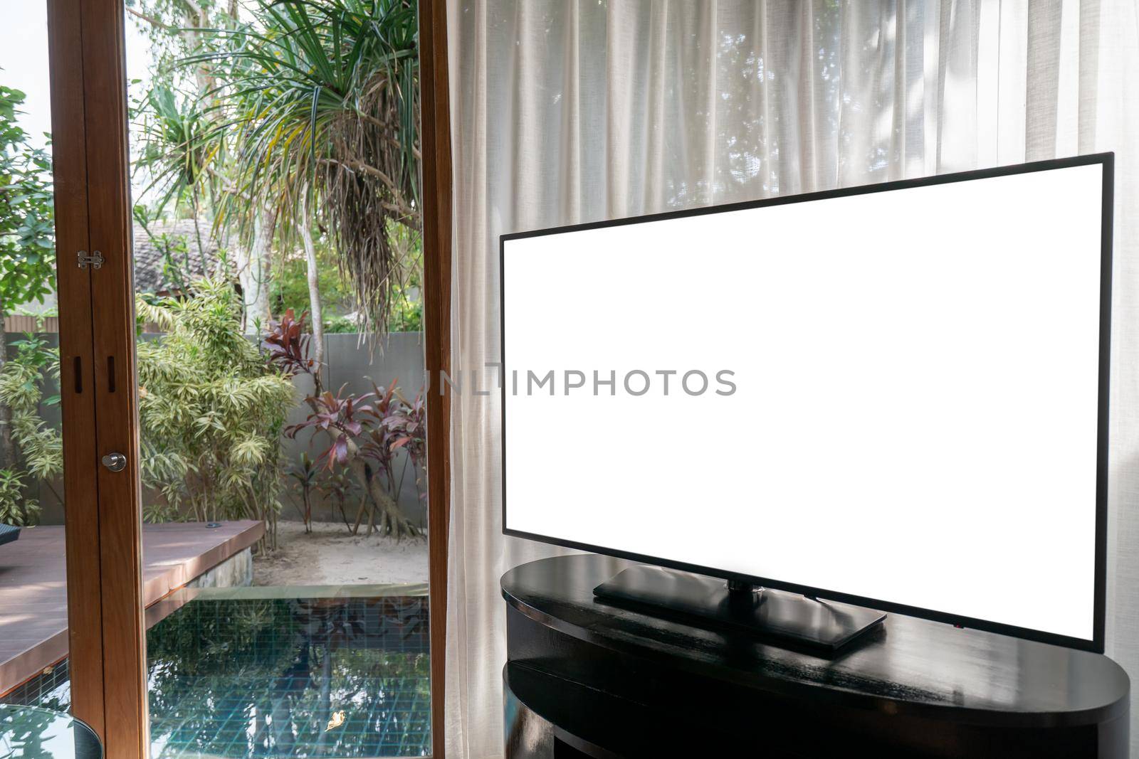 Interior of room, large window white curtain pool view, mock up tv white screen on the table.