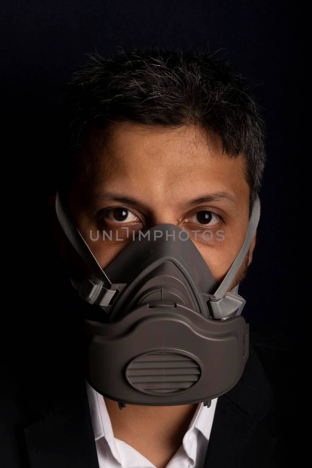 Young handsome with industrial mask to prevent the spread of contagious viruses or chemical gases by eagg13
