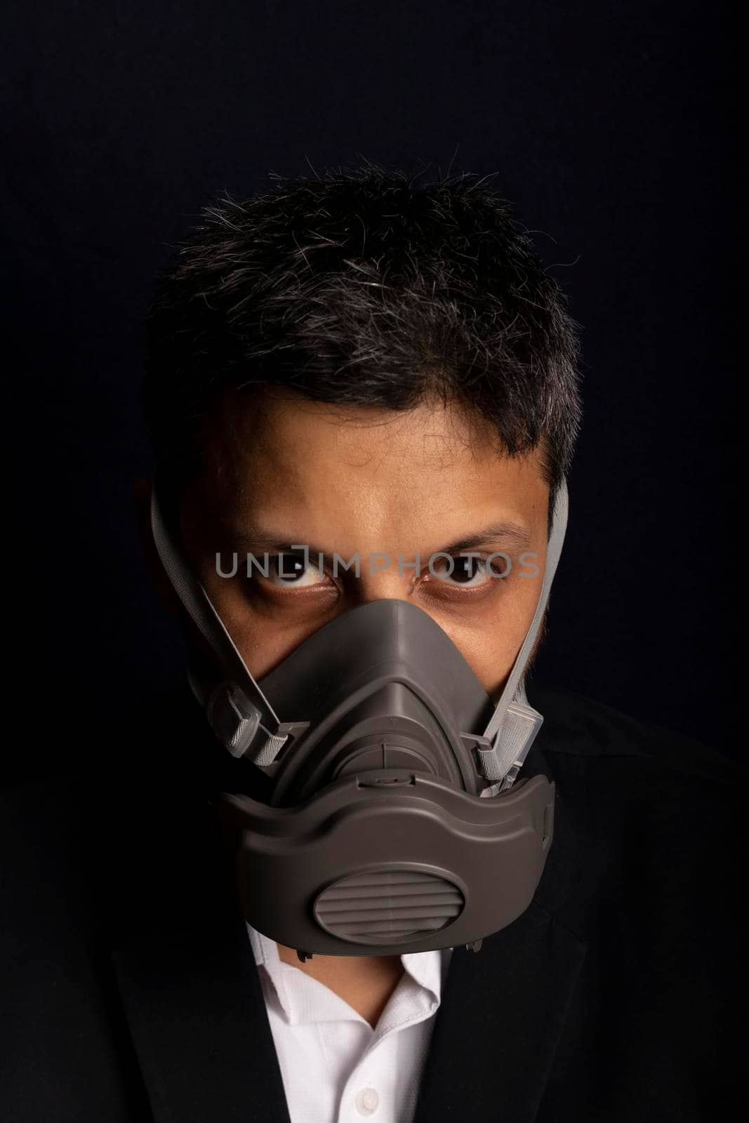 Young handsome with industrial mask to prevent the spread of contagious viruses or chemical gases by eagg13