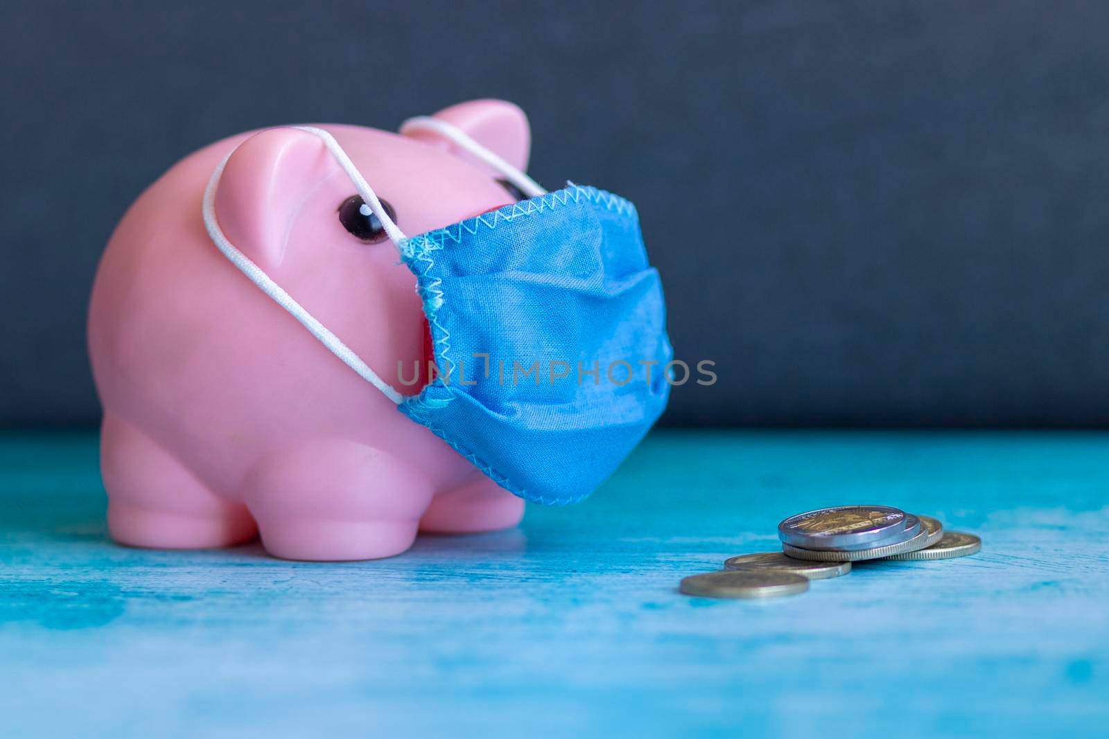 Pink piggy bank with medical mask by eagg13