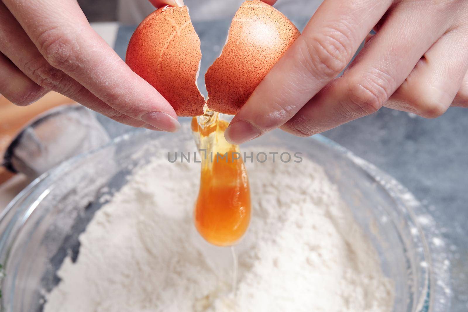 Fresh chicken egg, knife and wheat flour