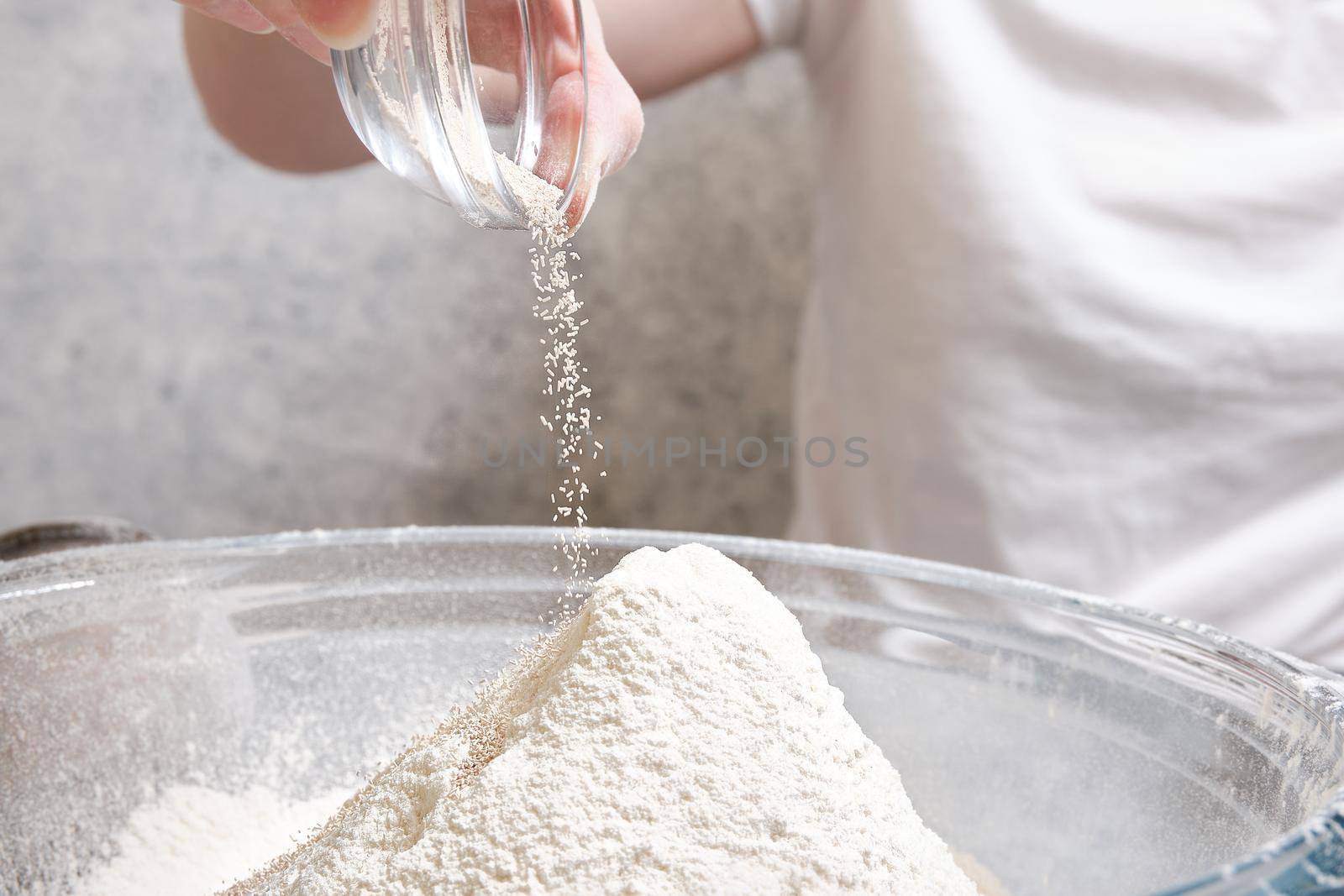 Flour is sieved with a metal sieve